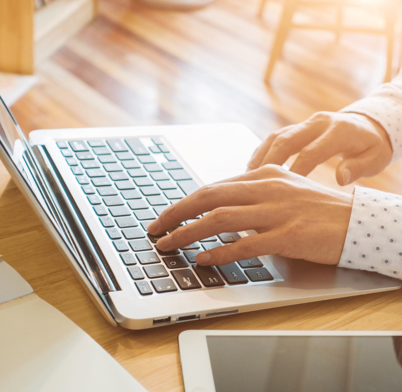 Person typing on a laptop